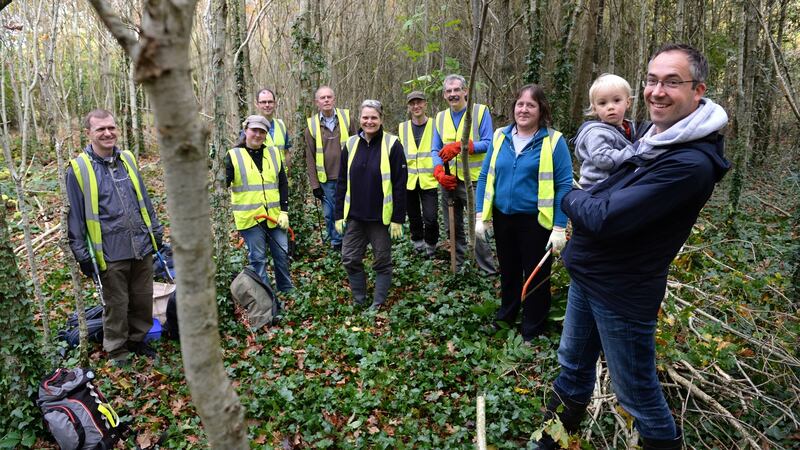 Teamwork: Hans Visser (right, with son Sean) and Conservation Volunteers Dublin, who have been working at Rogerstown Estuary. Photograph: Dara Mac Dónaill