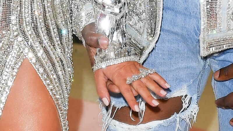 Kardashian jewellery raid: some of Kim Kardashian’s jewellery; the other hand belongs to her husband, Kanye West. Photograph: George Pimentel/WireImage/Getty