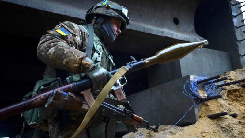 A Ukrainian serviceman is seen during fighting with pro-Russian separatists in Pesky village. Ukrainian President Petro Poroshenko accused Russia on Wednesday of sending 9,000 troops to back separatist rebels in the east of his country, and the IMF chief said she backed extra financial help for Kiev as the conflict inflicts severe economic damage. Photograph: Oleksandr Klymenko/Reuters