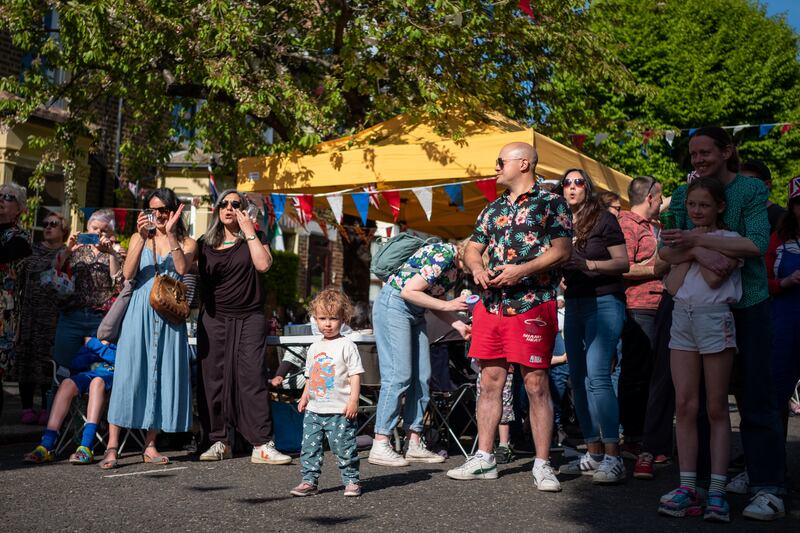 Residents of Godwin Road, London enjoy their street party being held to mark the coronation weekend. Photograph: Ian Forsyth/Getty