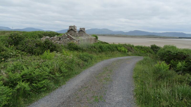 Inishbiggle: the fields are empty and silent, while the roadside is sprinkled with abandoned cottages