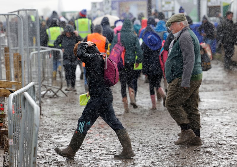 Attendees make their way through the rain on day two. Photograph: Alan Betson/The Irish Times