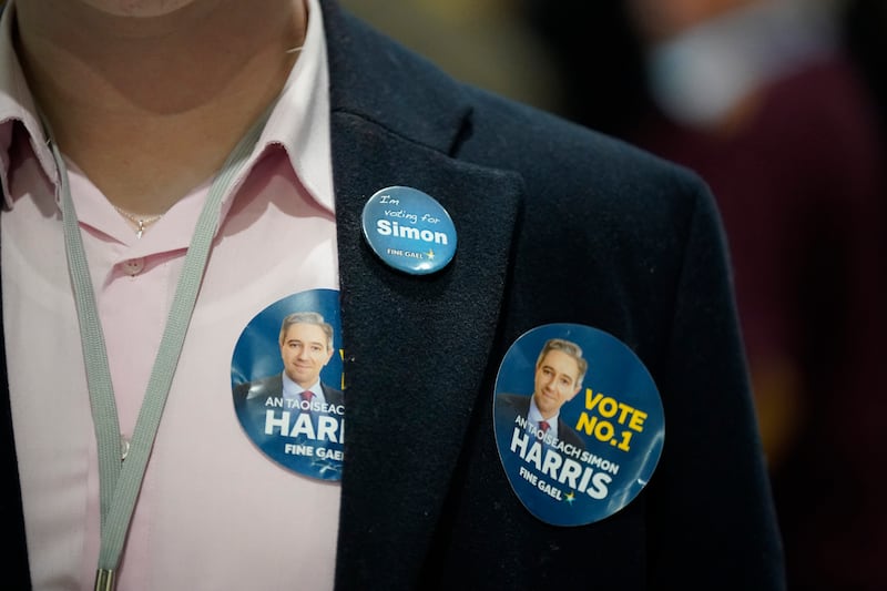 A Fine Gael tallyman wears Simon Harris stickers as counting takes place in Greystones. Photograph: Niall Carson/PA