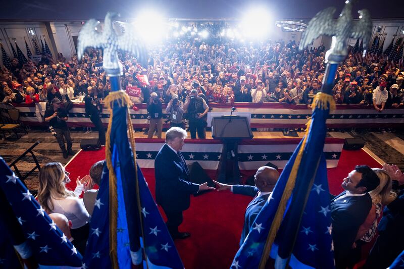 
Former President Donald Trump shakes hands with Senator Tim Scott  after defeating Nikki Haley in the New Hampshire primary election. Photograph: Doug Mills/New York Times
                      