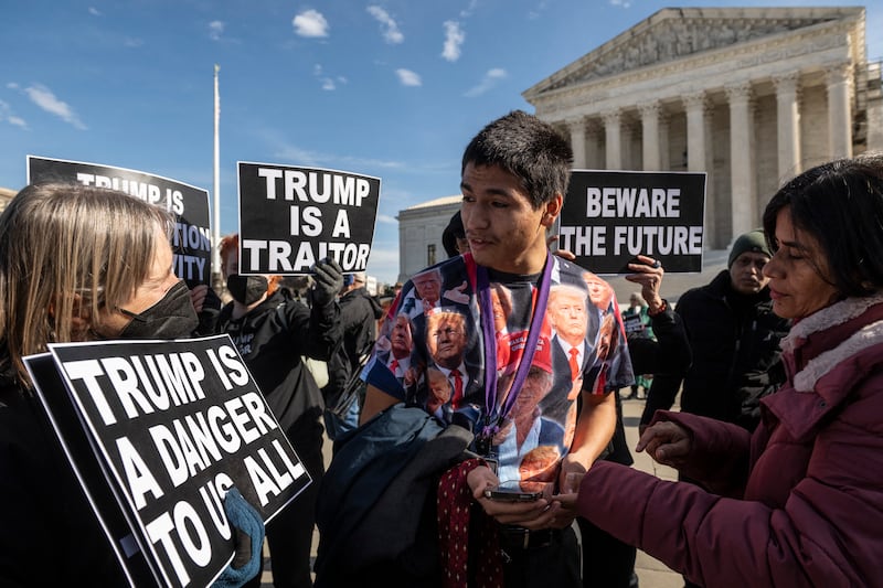 Gabriel Chambers , a supporter of former US President Donald Trump, speaks anti-Trump demonstrators protesting outside the US Supreme Court in Washington. Photograph: Roberto Schmidt/AFP via Getty Images