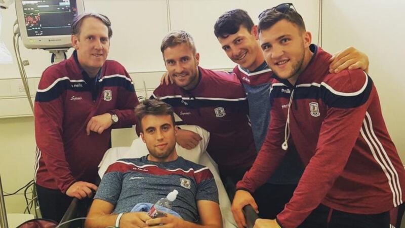 Members of the Galway squad and management team visiting Paul Conroy in hospital.