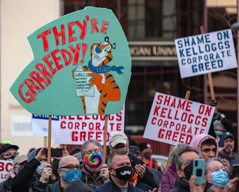 Signs are held during a rally where US senator Bernie Sanders spoke to striking Kellogg workers in downtown Battle Creek, Michigan, in the US. Photograph: Seth Herald/ AFP