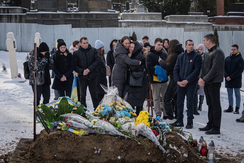 People attend the funeral in Lviv of Ukrainian soldiers Bogdan Baran, Mihajlo Popic and Vitaly Fedor on February 9th. Photograph: Adri Salido/Anadolu Agency via Getty Images