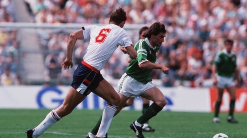 Ray Houghton goes past Tony Adams at Euro ’88. Photograph: Billy Stickland/Inpho