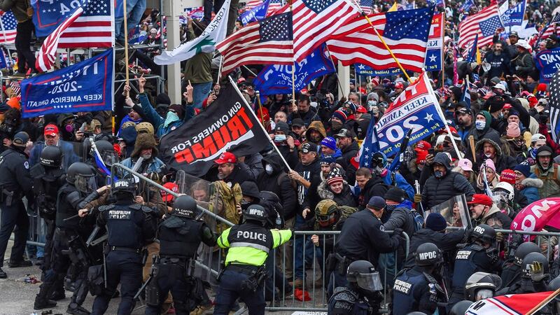 Trump supporters clash with police and security forces as they storm the US Capitol in Washington DC. Photograph: Roberto Schmidt/AFP via Getty