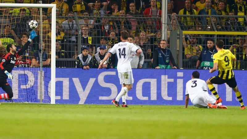 Borussia Dortmund’s Robert Lewandowski (L) scores his third . Photograph: Wolfgang Rattay/Reuters