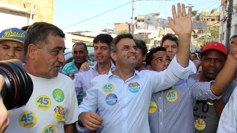 Brazilian Social Democracy Party  presidential candidate Aecio Neves (C) attends an electoral campaing at Pedreira Padro Lopes in Belo Horizonte. Photograph: Paulo Fonseca/EPA.