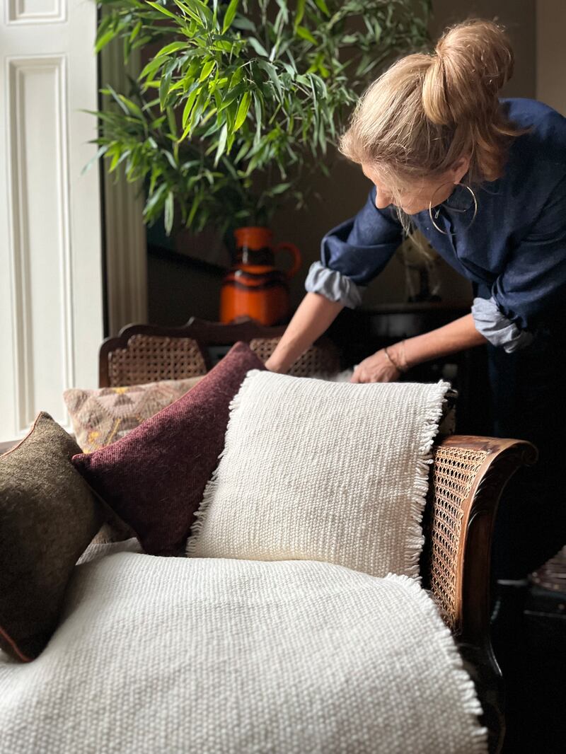 Frances Duff, cofounder Stable of Ireland, with textiles spun by Studio Donegal from Catherine McCann's sheep for the Wicklow Wool Project