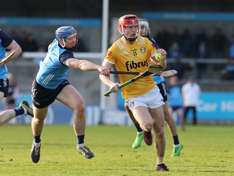 Dublin's Conor Burke challenges James McNaughton of Antrim at Parnell Park. Photograph: Lorraine O’Sullivan/Inpho