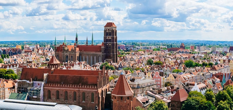 Gdańsk old town centre with the red-brick St Mary’s Church in the foreground. Photograph: Andrey Danilovich/Getty