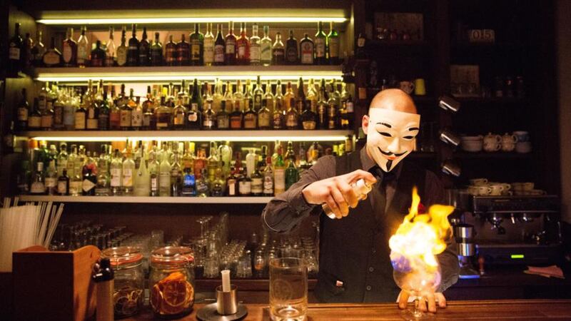 Preparing a drink at Anonymous Bar