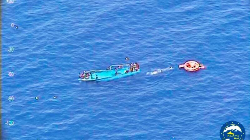 Migrants are seen on a partially submerged boat before to be rescued by Spanish fregate Reina Sofia (unseen) taking part in the European Union military operation in the Southern Central Mediterranean (EUNAVFOR MED) off the coast of Liby. Photograph: EU NAVFOR MED/Reuters