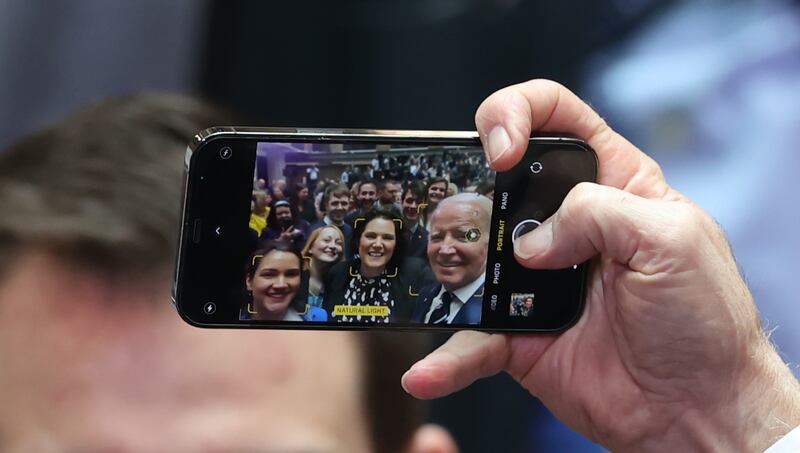 US president Joe Biden takes a selfie with Claire Hanna of the SDLP (centre) following his speech at Ulster University in Belfast. Photograph: Liam McBurney/PA