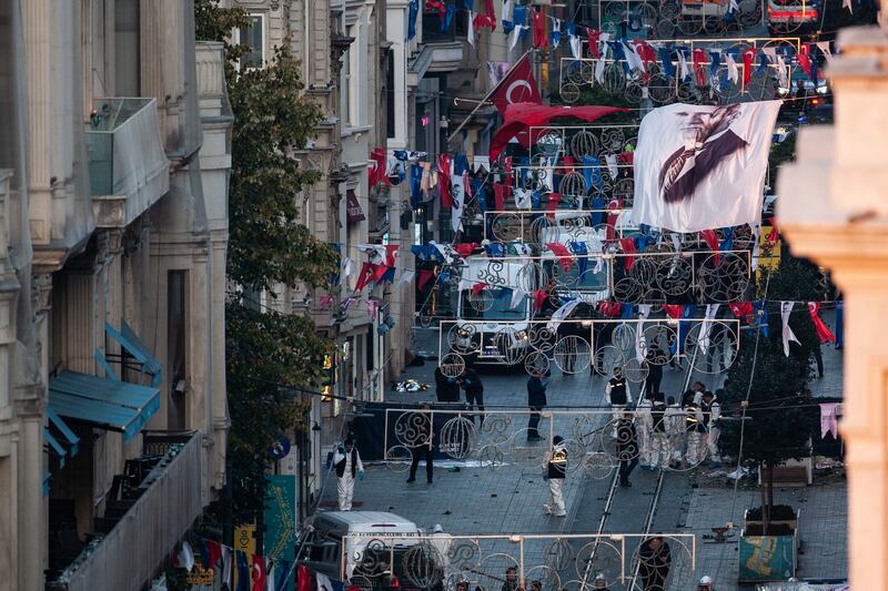 Emergency personnel investigate the scene after the explosion on Istiklal Avenue. Photograph: Burak Kara/Getty Images