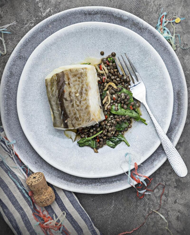 Baked hake with lentils, baby spinach, ginger and chilli