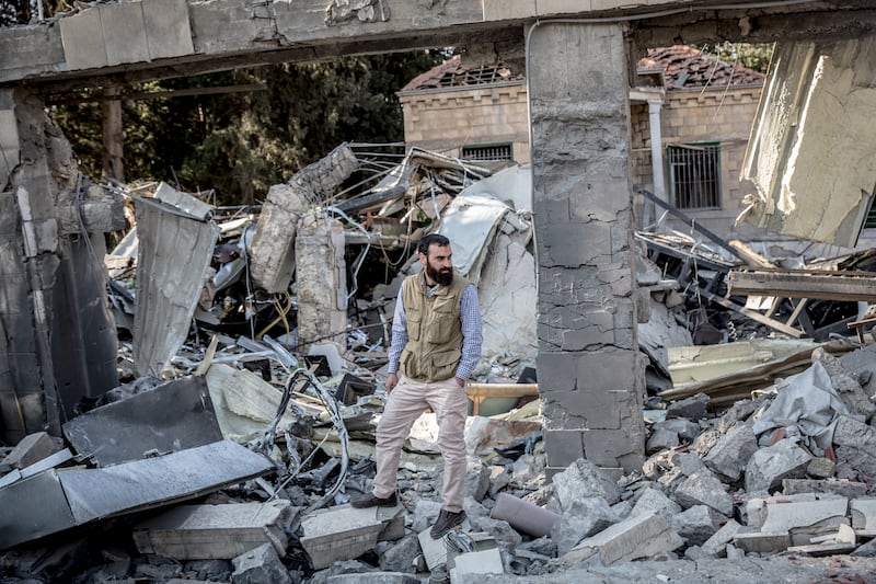 Mahmoud Habib, the owner of Al Rida cafe and restaurant, stands among its ruins. Photograph: Sally Hayden