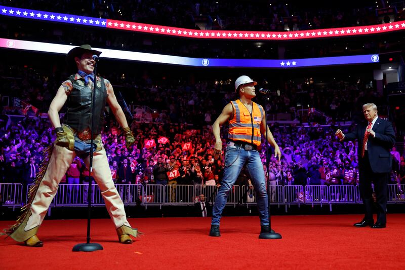 Donald Trump dances on stage while the Village People perform YMCA during the US presidential inauguration. Photograph: Anna Moneymaker/Getty Images