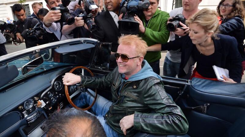 Chris Evans leaves the BBC Radio studios in London, in his vintage Aston Martin, after he was announced as the new ‘Top Gear’ presenter. Photograph: John Stillwell/PA Wire