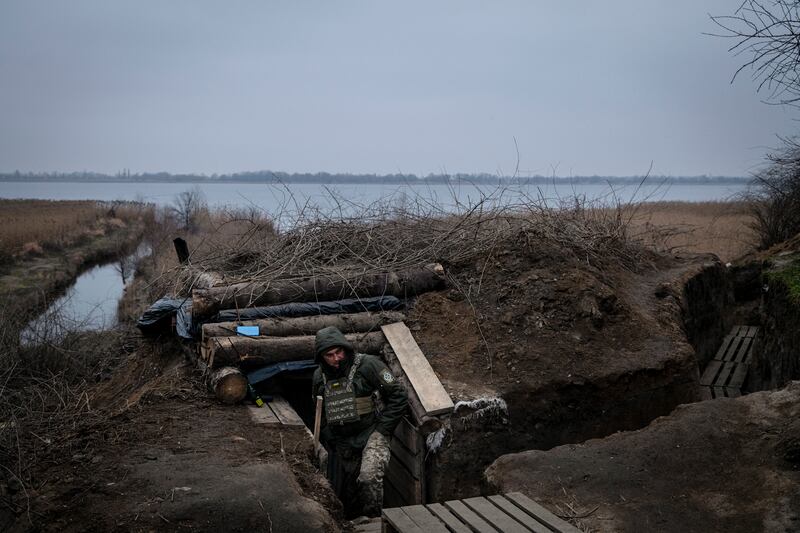 A Ukrainian soldier stands at the mouth of a bunker, in the vast network of defenses dug along the Dnieper and its tributaries, in the Kherson region on January 23rd. Photograph: Nicole Tung/The New York Times