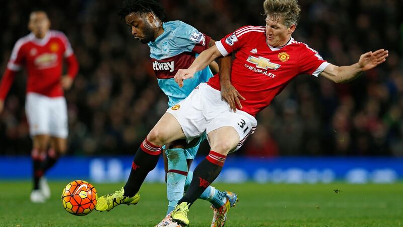 Manchester United’s Bastian Schweinsteiger and West Ham’s Alex Song battle for possession during the game at Old Trafford. Photograph: Lee Smith/Reuters.