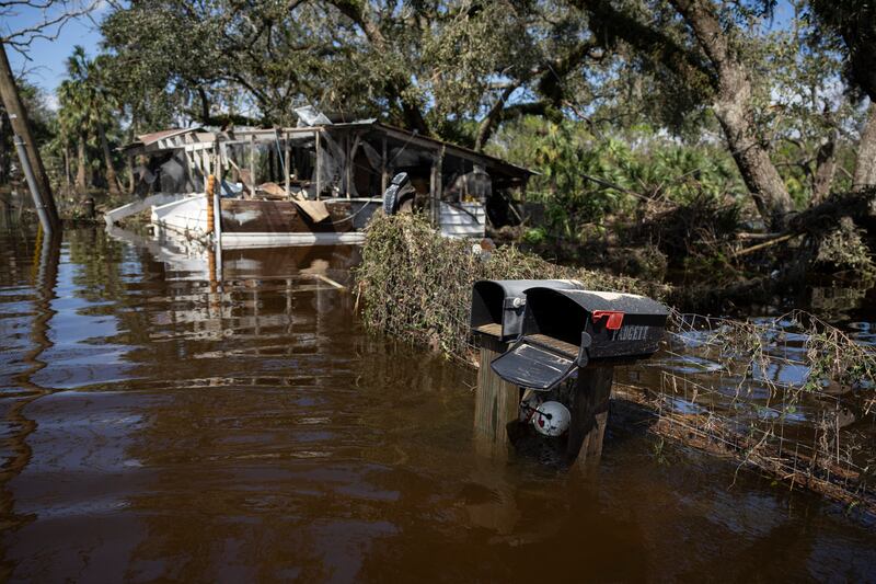 A damaged house on a flooded street  after Hurricane Helene made landfall in Steinhatchee, Florida. Photograph: Ricardo Arduengo/AFP via Getty Images