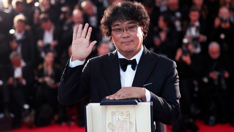 South Korean director Bong Joon-ho poses with his Palme d’Or at the Cannes Film Festival, in Cannes, France. Photograph: Ian Langsdon/EPA