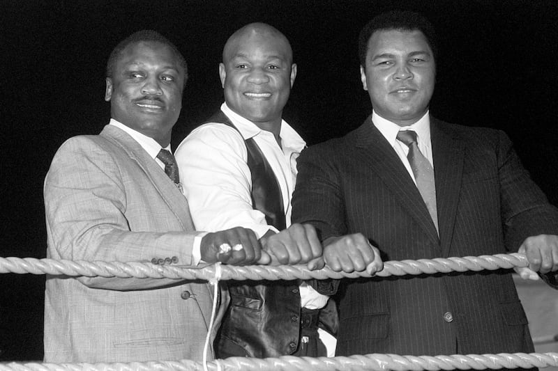 Former world heavyweight champions Joe Frazier, George Foreman and Muhammad Ali. Photograph: PA Wire