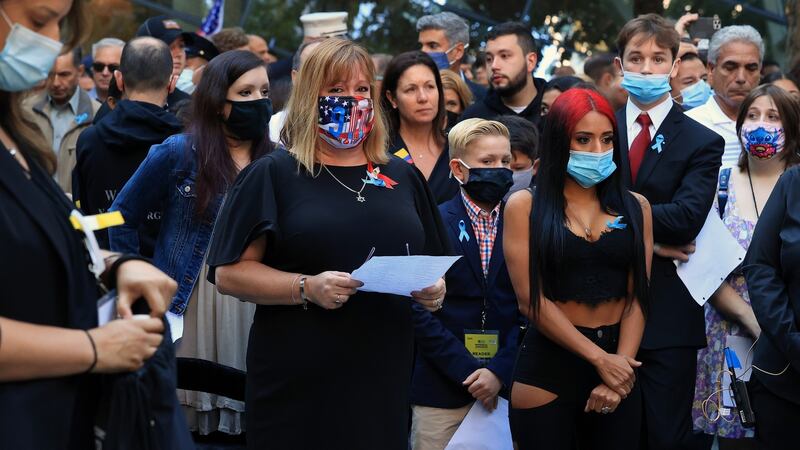 Relatives begin  to read aloud the names of 2,977 victims to the thousands who gathered at the the annual 9/11 commemoration ceremony in New York. Photograph: Chip Somodevilla/Getty