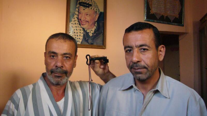 Homeland: Mohamed Abu Jiyaab, with his brother Hussein, holds the key to the house in Israel that their father fled in 1948. Photograph: Lara Marlowe