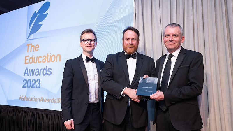 Declan Allen, awards judge, presents the Best Language School award to Darren Ó Rodaigh and Pádraig Mac Congáil, Coláiste na hÉireann/Gaelchultúr.