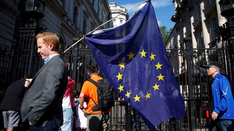 A man carries a EU flag  outside Downing Street in London. Leading Irish businesses have voiced concern about Britain’s decision to leave the EU