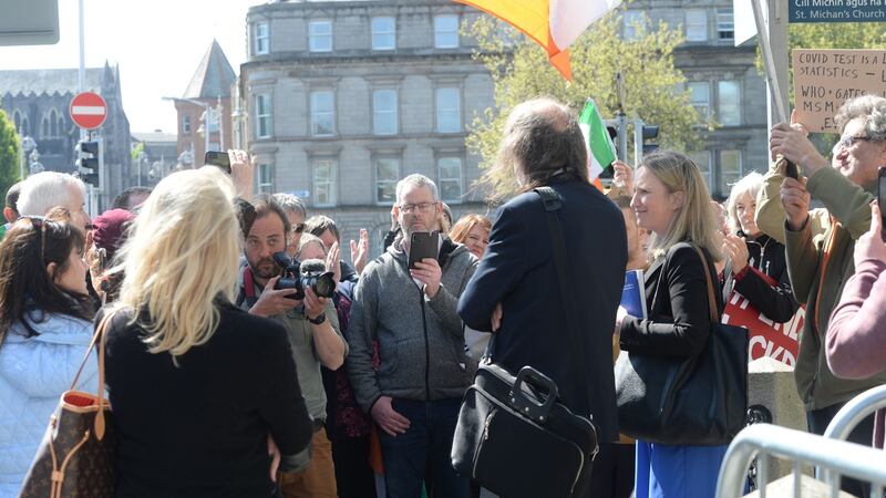 Gemma O’Doherty and John Waters speaking to a group of supporters outside the Four Courts during a break in proceedings. Photograph: Alan Betson/The Irish Times