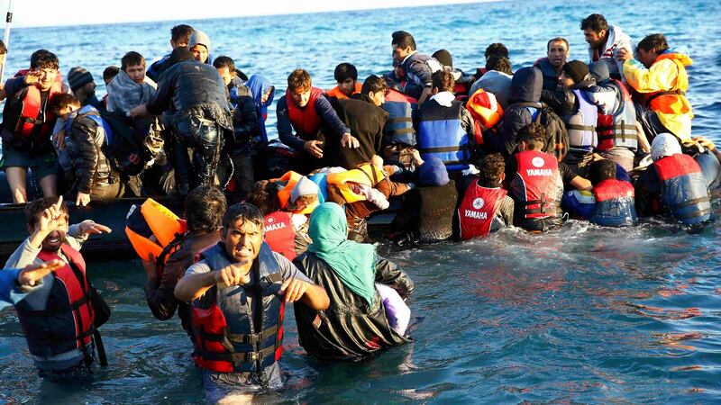 Migrants clamber on to a dinghy to sail to Chios from the western Turkish coastal town of Cesme: A staggering 20,000 migrants are known to have died while trying to cross the Mediterranean since 2014. File photograph: Umit Bektas/Reuters