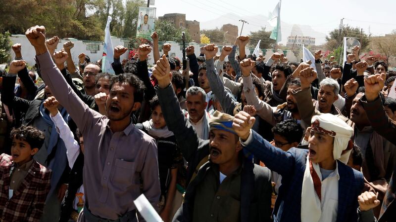 Yemenis shout slogans as they attend the funeral of slain Houthi fighters: The conflict has caused 233,000 deaths over the past five years. Photograph: Yahya Arhab