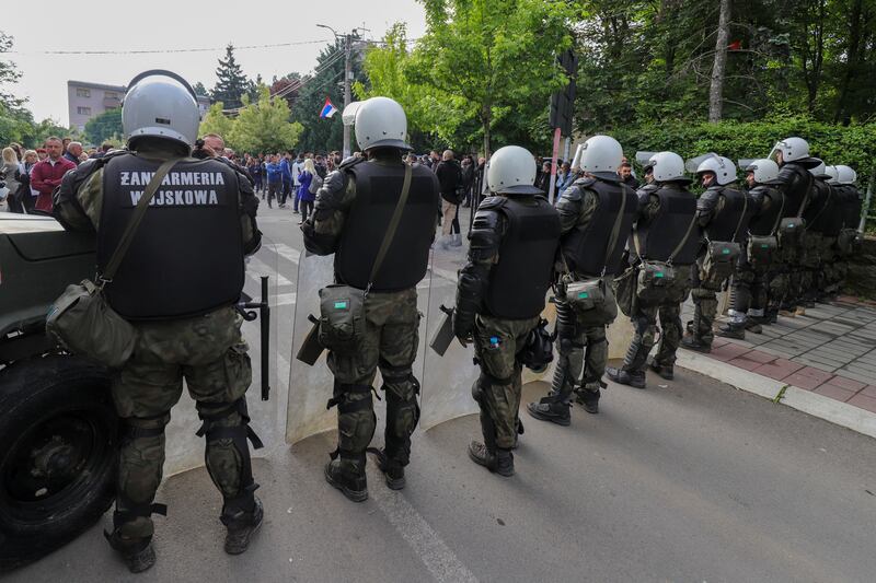 Polish soldiers, part of the peacekeeping mission in Kosovo KFOR, guard a municipal building in the town of Zvecan. Photograph: Bojan Slavkovic/AP