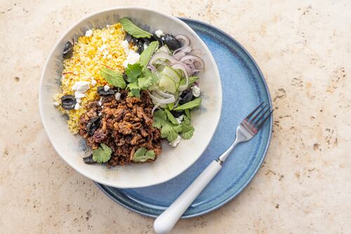 Stir fry spiced lamb with cous cous, olives and mint