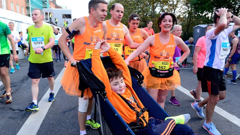 Archie Naughton from Roscommon stretches at the end of the marathon with Mark Gilleran, Frank Murphy, Tonya Hand and Sinead Gannon. Photograph: Cyril Byrne