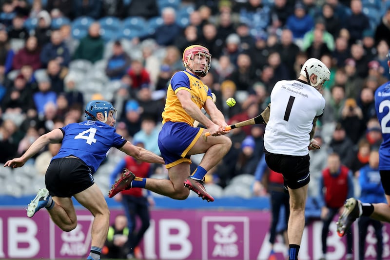 Na Fianna's AJ Murphy has a shot saved by Ben Graham of Sarsfields. Photograph: Bryan Keane/Inpho