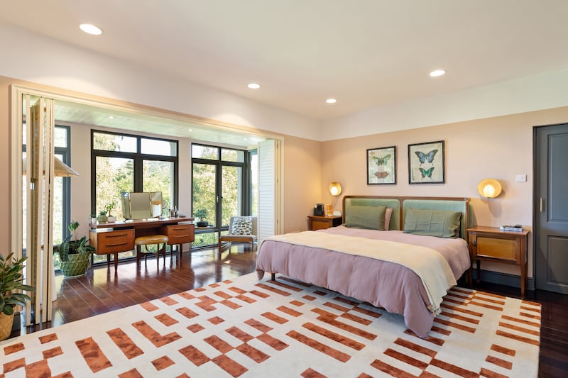 The main bedroom has two balconies that look out over the sea