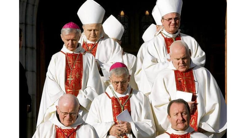 Bishops and clergy emerge following the Requiem Mass at St Patricks Cathedral, Armagh, including Bishop John Fleming of Killala (top left), Bishop Leo OReilly of Kilmore (second from top left), Auxiliary Bishop of Derry Francis Lagan (centre with head down) and Liam Bergin, rector of the Irish College in Rome (bottom right);