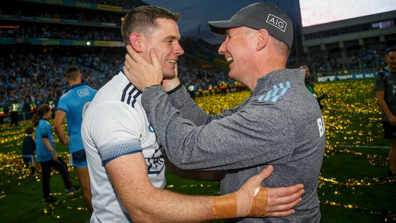 Stephen Cluxton celebrates with manager Jim Gavin after the game. Photograph: Oisin Keniry/Inpho