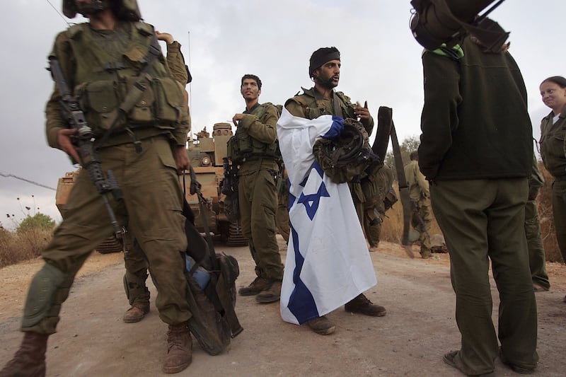 Israeli infantry soldiers cross the Lebanese border back into northern Israel on August 9th, 2006. Photograph: John Moore/Getty Images