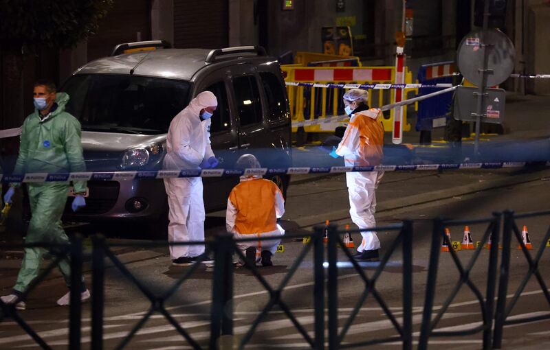 Belgian police officers search for evidence after two people were killed during a shooting in Brussels on October 16, 2023 evening by a suspect who is on the run, the Belgian capital's prosecutor's office said. Photograph: Kenzo Tribouillard?AFP via Getty Images