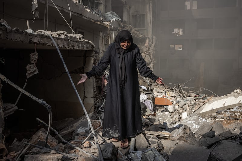 Miriam al-Shami, whose husband and mother-in-law were killed, cries where her destroyed home once stood as emergency services look for people in the rubble at the site of an Israeli air strike that hit the densely populated Basta district of Beirut without warning on Saturday. Photograph: Ed Ram/For The Washington Post via Getty Images