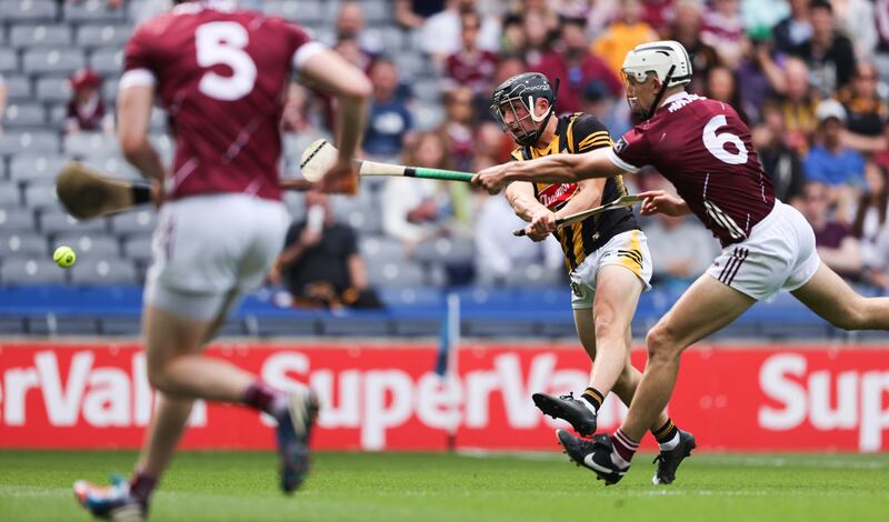 Kilkenny's Mikey Butler shooting to score his side’s third goal of the Leinster championship final despite Daithi Burke of Galway. Photograph: Tom Maher/Inpho